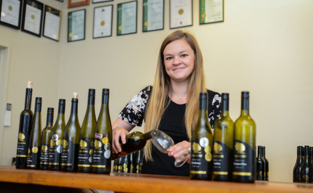 Rebecca serving award winning aromatic wine in the Askerne Winery Cellar Door Hawkes Bay New Zealand